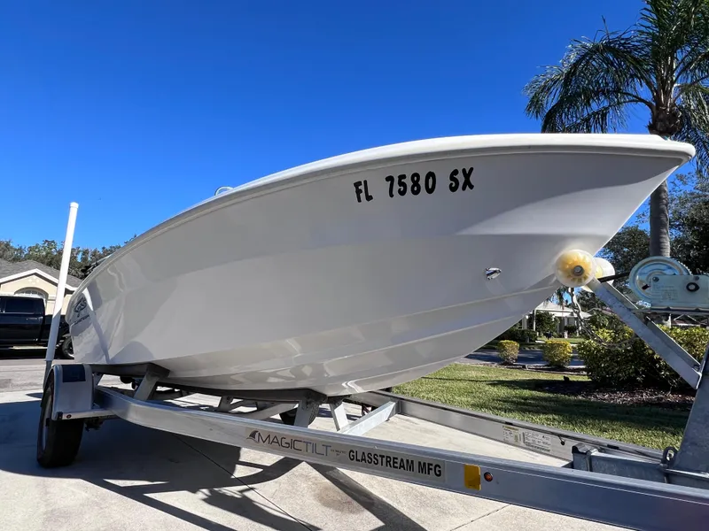 Slide: The Image of 2021 Glasstream 180 CC boat on trailer, sunny day, palm trees in background. - 8
