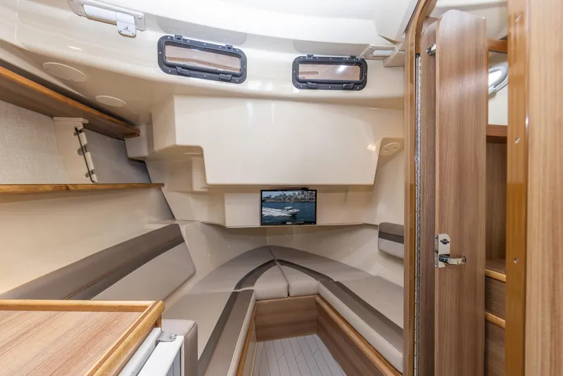 Slide: The Image of Interior of 2025 Solara S-310 CW boat, featuring cozy seating and modern design. - 20