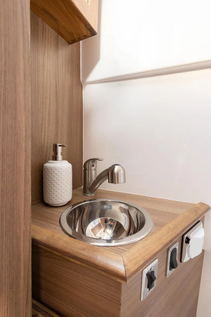 Slide: The Image of Compact sink area in 2025 Solara S-310 CW with modern fixtures. - 23