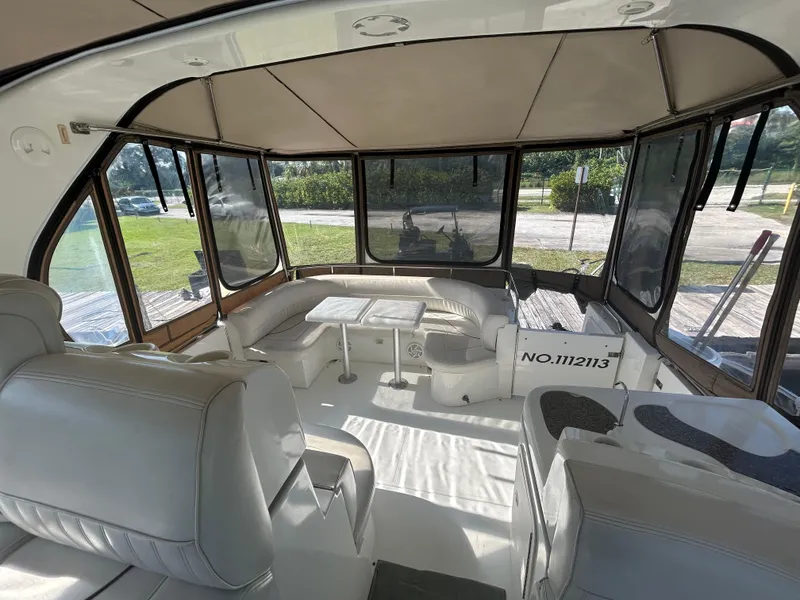 Slide: The Image of Interior of 2001 Cruisers Yachts 4450 Express Motoryacht with seating and windows. - 37