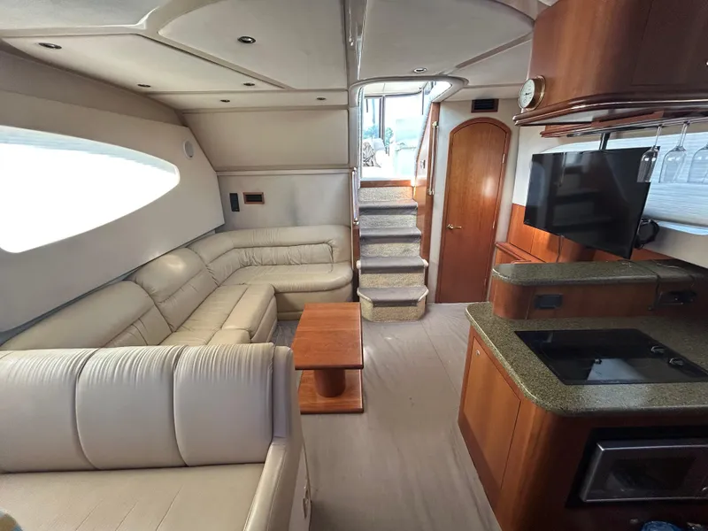 Slide: The Image of Luxurious interior of 2001 Cruisers Yachts 4450 Express Motoryacht with leather seating and modern amenities. - 41