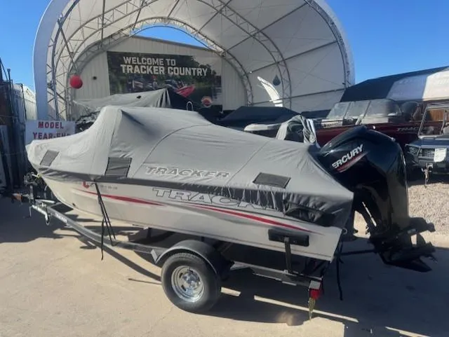 Slide: The Image of 2019 Tracker PGV16 boat with cover in dealership lot. - 3