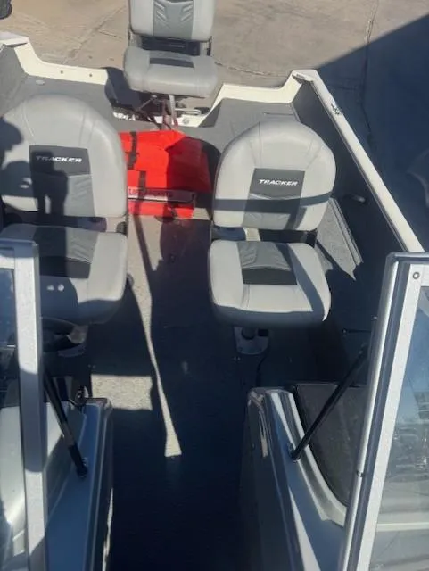 Slide: The Image of 2019 Tracker PGV16 boat interior with gray seating and red storage box. - 6