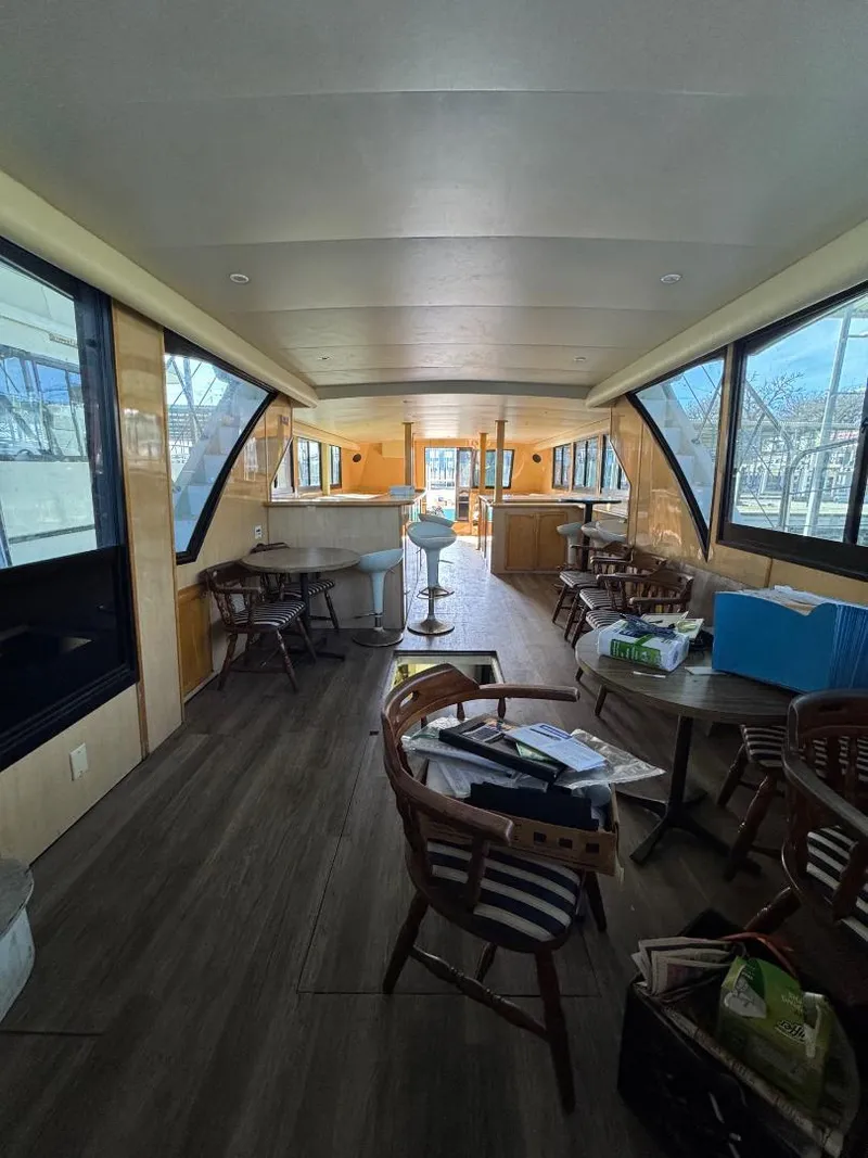 Slide: The Image of Interior of 2000 Bluewater Yachts 5200 Millenium with spacious seating and large windows. - 10