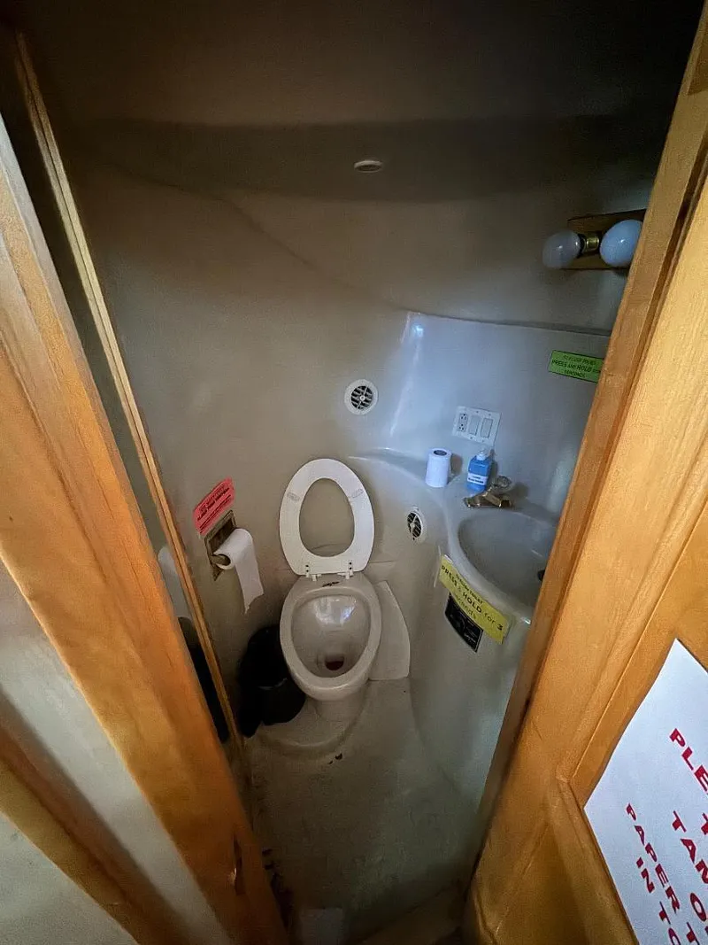 Slide: The Image of Compact bathroom in a 2000 Bluewater Yachts 5200 Millenium boat. - 12