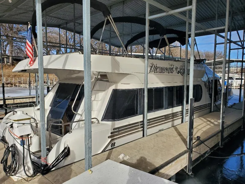 Slide: The Image of 2000 Bluewater Yachts 5200 Millenium docked under a covered marina. - 15