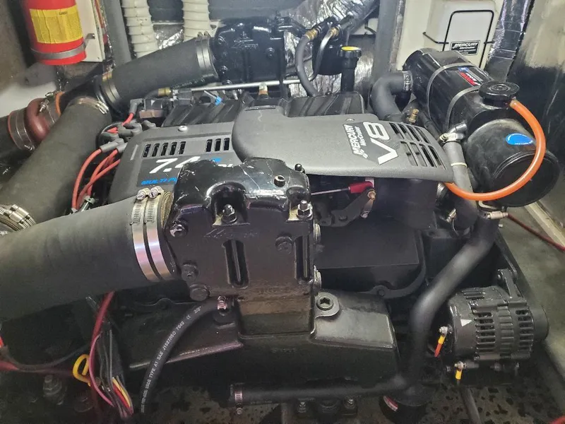 Slide: The Image of Engine compartment of a 2000 Bluewater Yachts 5200 Millennium, featuring a powerful V8 engine. - 19