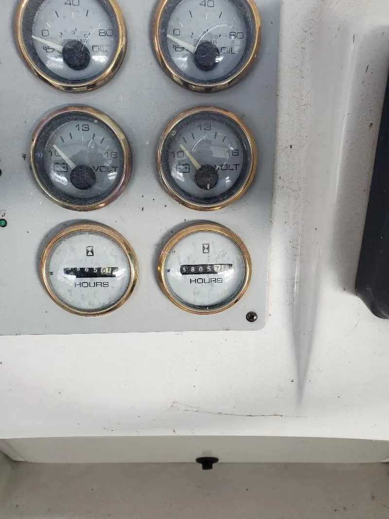 Slide: The Image of Dashboard gauges of a 2000 Bluewater Yachts 5200 Millenium boat. - 20