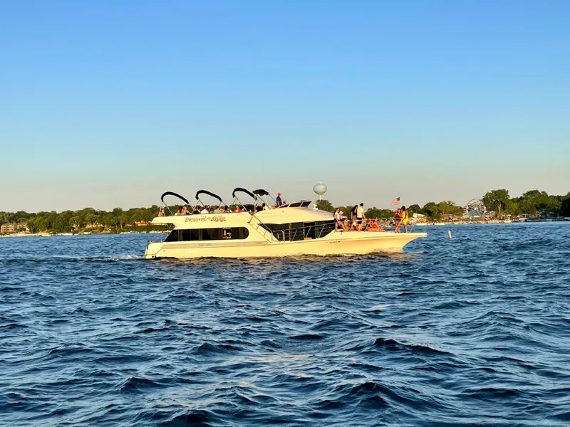 Slide: The Image of Bluewater Yachts 5200 Millennium 2000 cruising on a sunny day with passengers onboard. - 24