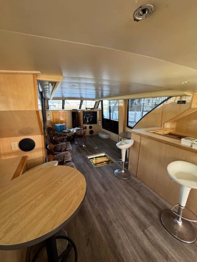 Slide: The Image of Interior of 2000 Bluewater Yachts 5200 Millenium with modern seating and wooden finishes. - 28