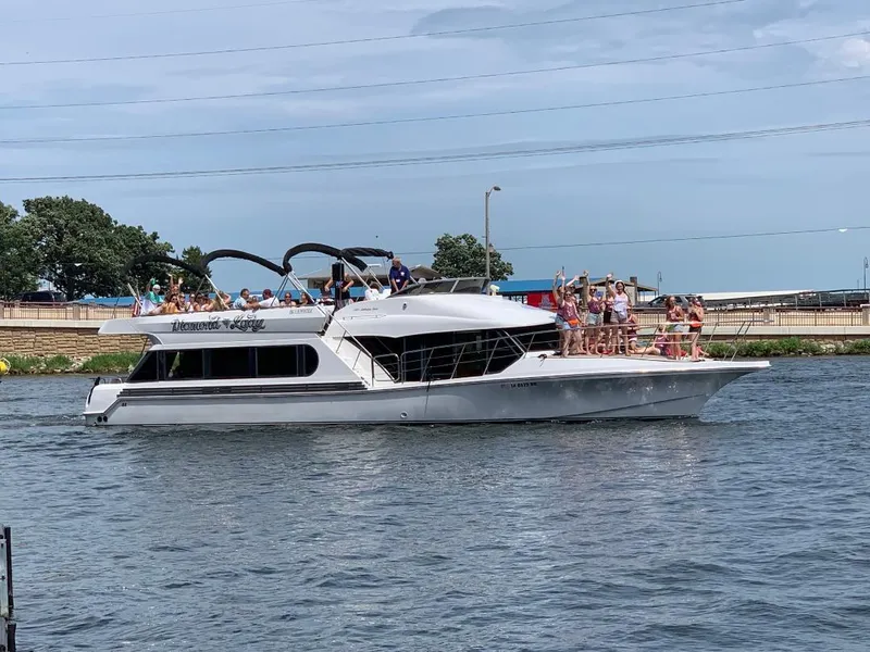 Slide: The Image of 2000 Bluewater Yachts 5200 Millenium cruising with passengers on a sunny day. - 3