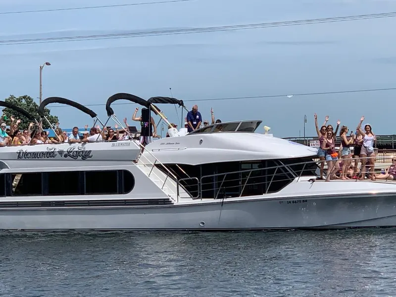 Slide: The Image of 2000 Bluewater Yachts 5200 Millennium with people celebrating on deck. - 4