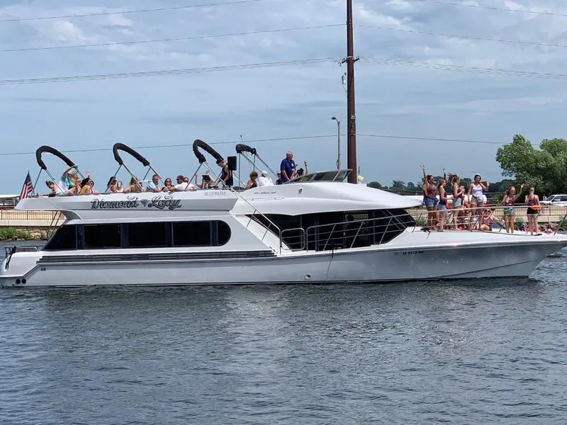 Slide: The Image of 2000 Bluewater Yachts 5200 Millenium with passengers on deck, cruising on a sunny day. - 6