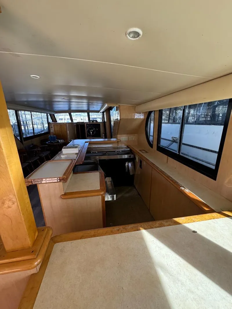 Slide: The Image of Interior of 2000 Bluewater Yachts 5200 Millenium with spacious layout and large windows. - 7