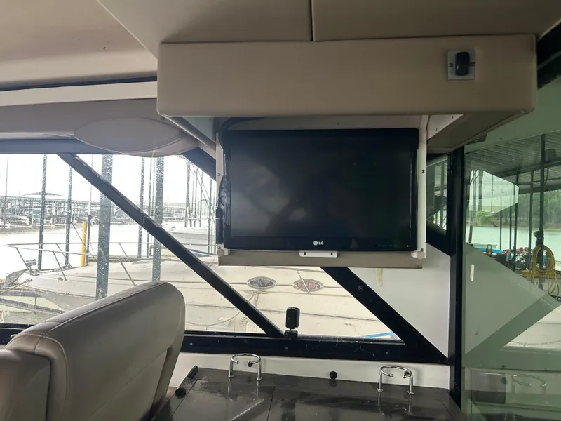 Slide: The Image of Interior of 2014 Regal 44 Sport Coupe with LG TV and marina view. - 14