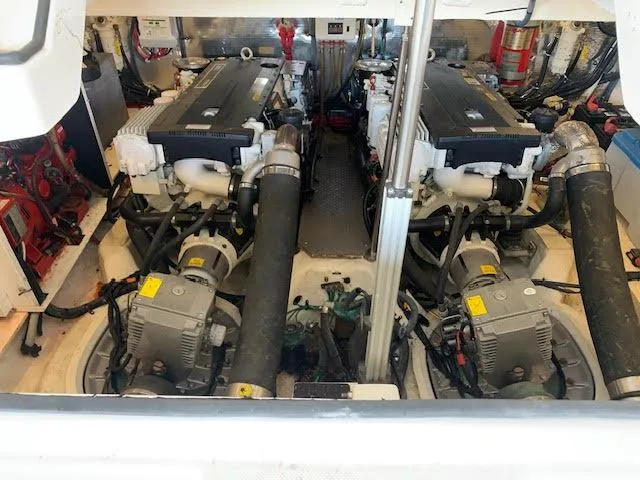 Slide: The Image of Engine room of 2014 Regal 44 Sport Coupe with dual engines and mechanical components. - 19