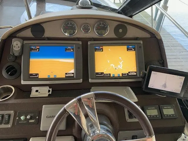 Slide: The Image of Dashboard of a 2014 Regal 44 Sport Coupe with navigation screens and controls. - 24