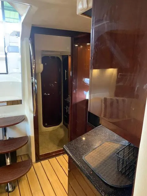 Slide: The Image of Interior of 2014 Regal 44 Sport Coupe with wooden stairs and sleek cabinetry. - 30