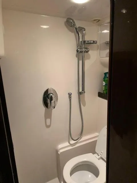 Slide: The Image of Bathroom in 2014 Regal 44 Sport Coupe yacht with shower and toilet. - 31