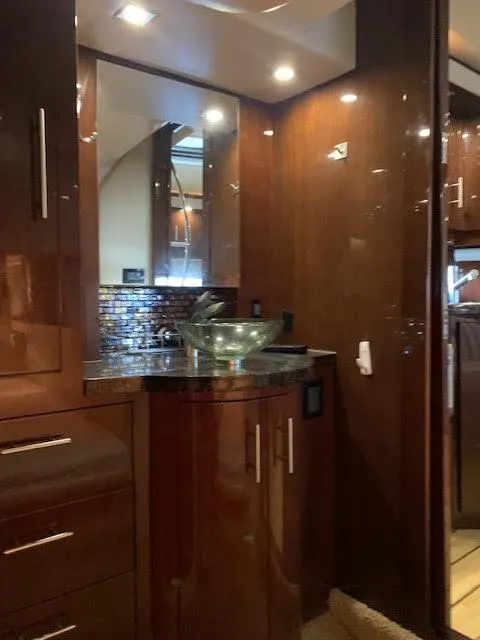 Slide: The Image of Luxurious interior of 2014 Regal 44 Sport Coupe with elegant wood finishes and modern fixtures. - 32