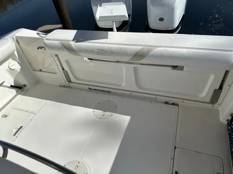 Slide: The Image of 2004 Boston Whaler 32 Outrage boat interior with white seating and deck. - 17