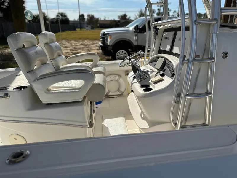 Slide: The Image of 2004 Boston Whaler 32 Outrage boat interior with steering console and seating. - 20