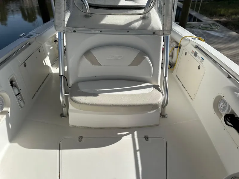 Slide: The Image of 2004 Boston Whaler 32 Outrage boat interior with seating and storage compartments. - 25