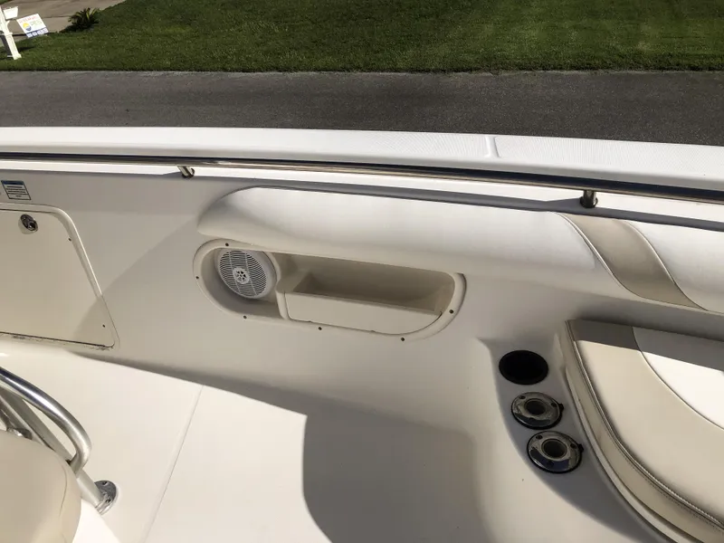 Slide: The Image of 2004 Boston Whaler 32 Outrage boat interior with seating and storage compartments. - 26