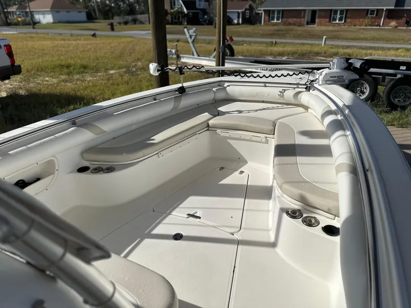 Slide: The Image of 2004 Boston Whaler 32 Outrage boat interior with seating and storage compartments. - 29