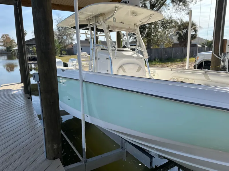 Slide: The Image of 2004 Boston Whaler 32 Outrage boat docked, side view. - 5