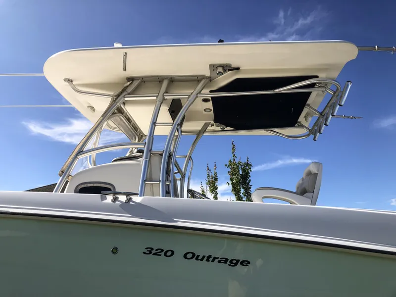 Slide: The Image of Boston Whaler 32 Outrage 2004 boat with T-top against blue sky. - 9