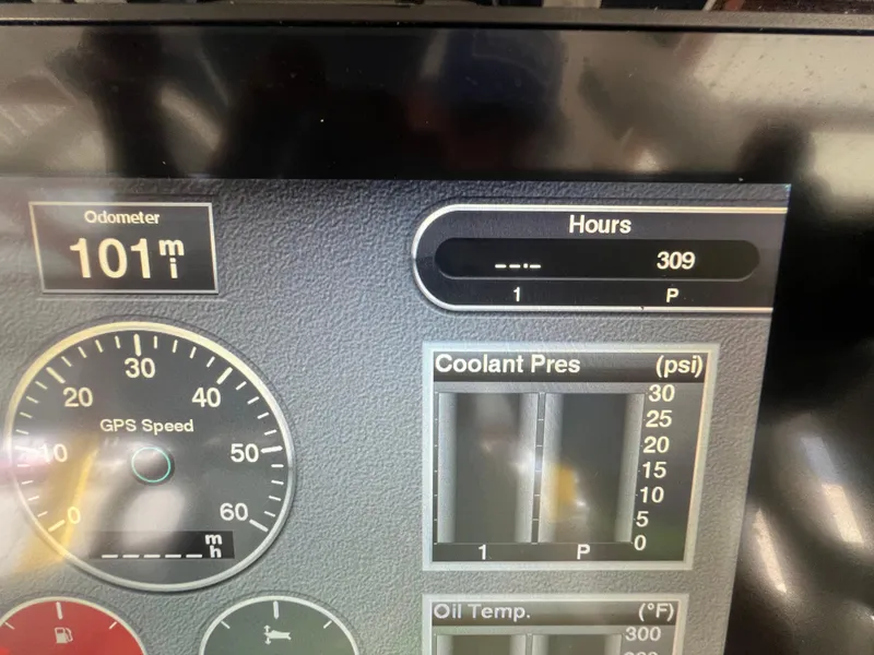 Slide: The Image of Dashboard of 2019 Robalo R242 Explorer showing odometer, hours, and coolant pressure. - 12