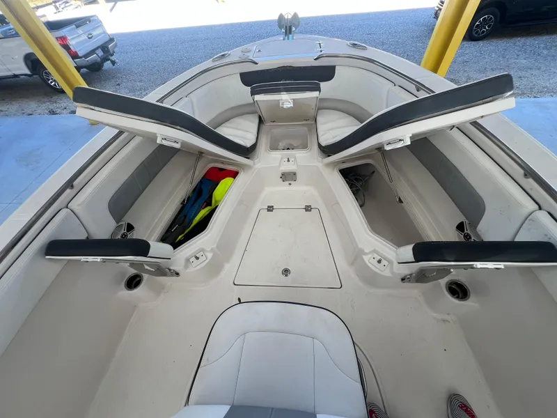 Slide: The Image of 2019 Robalo R242 Explorer boat interior with open storage compartments. - 15