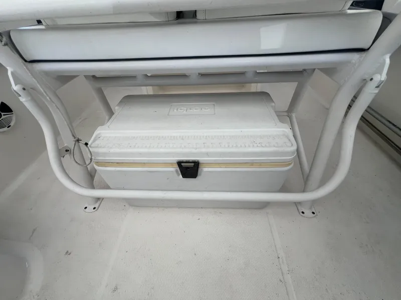 Slide: The Image of Robalo R242 Explorer 2019 boat interior with Igloo cooler storage. - 21