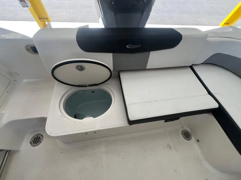 Slide: The Image of 2019 Robalo R242 Explorer boat interior with seating and storage compartments. - 22