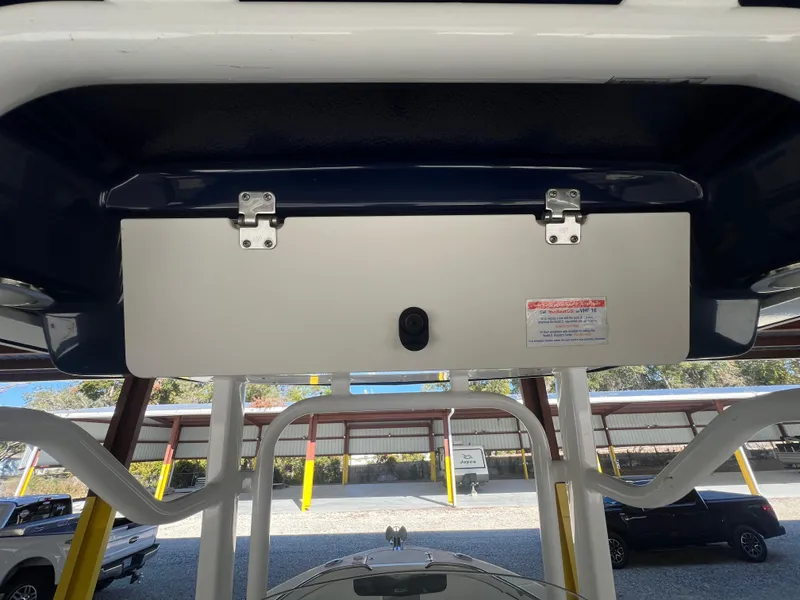 Slide: The Image of 2019 Robalo R242 Explorer boat storage compartment under T-top. - 23