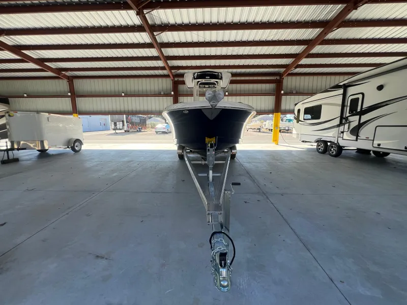 Slide: The Image of 2019 Robalo R242 Explorer boat on trailer in covered storage. - 6