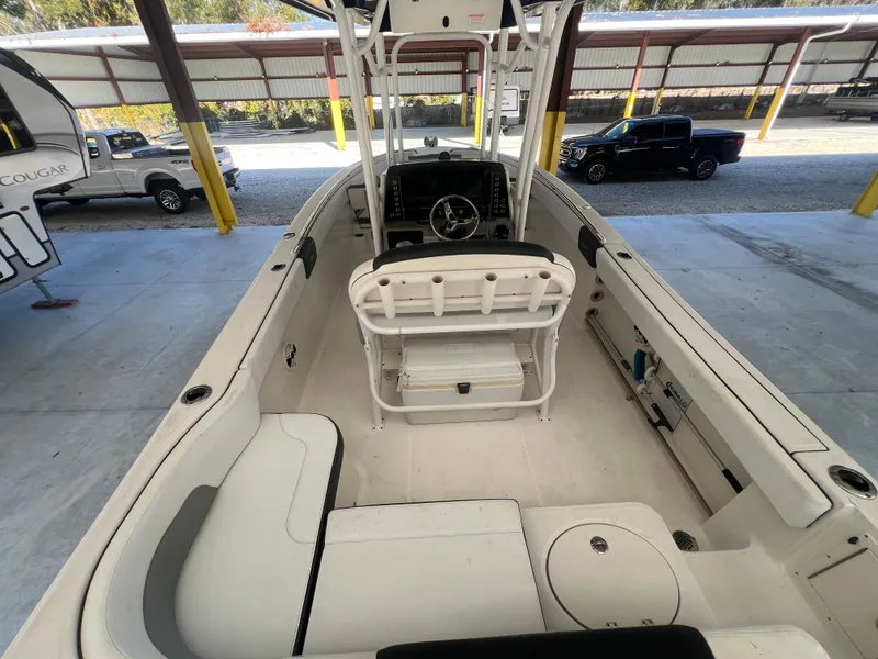Slide: The Image of 2019 Robalo R242 Explorer boat interior with seating and console. - 8