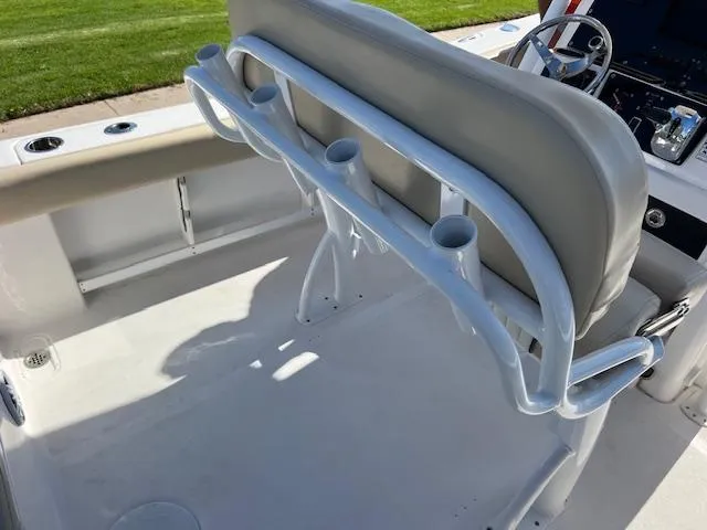 Slide: The Image of 2018 Sea Fox 248 Commander boat interior with rod holders and seating. - 17