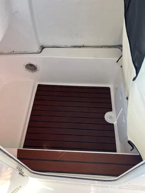 Slide: The Image of 2018 Sea Fox 248 Commander boat interior with wooden flooring. - 27