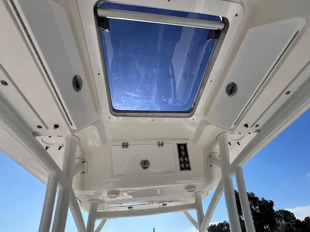 Slide: The Image of 2018 Sea Fox 248 Commander boat interior with skylight and control panel. - 30