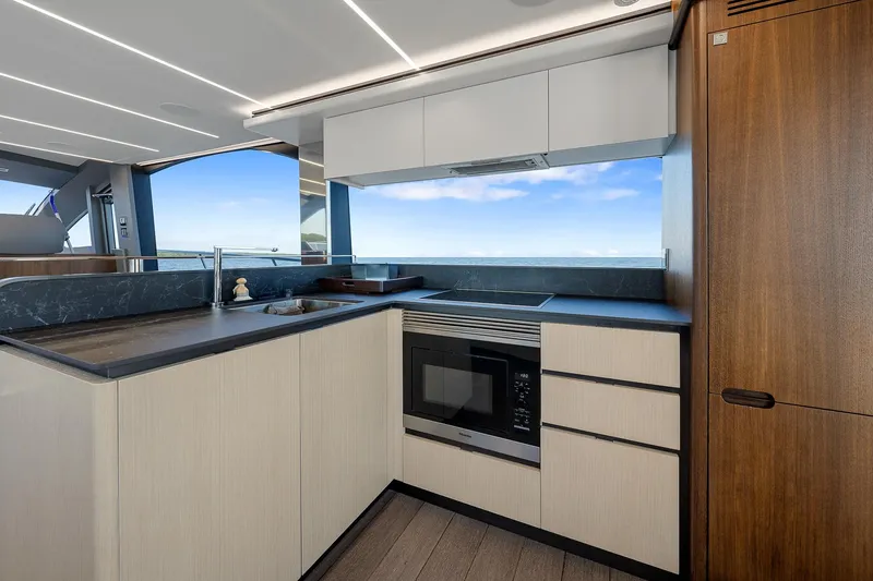 Slide: The Image of Modern kitchen interior on 2022 Astondoa 66 yacht with ocean view. - 12