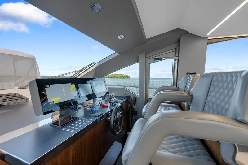 Slide: The Image of Luxurious 2022 Astondoa 66 yacht cockpit with modern controls and plush seating. - 15