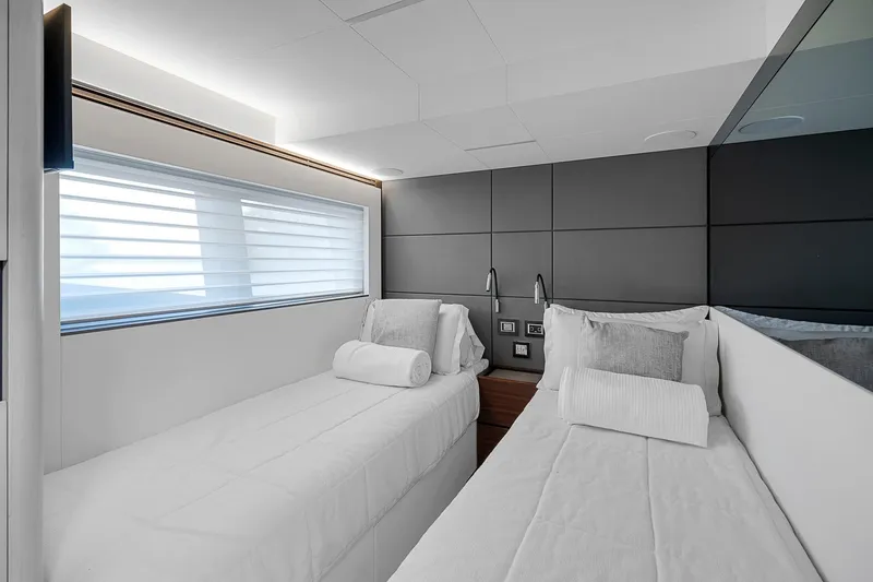 Slide: The Image of Luxurious twin cabin in 2022 Astondoa 66 yacht, featuring modern design and comfortable bedding. - 20