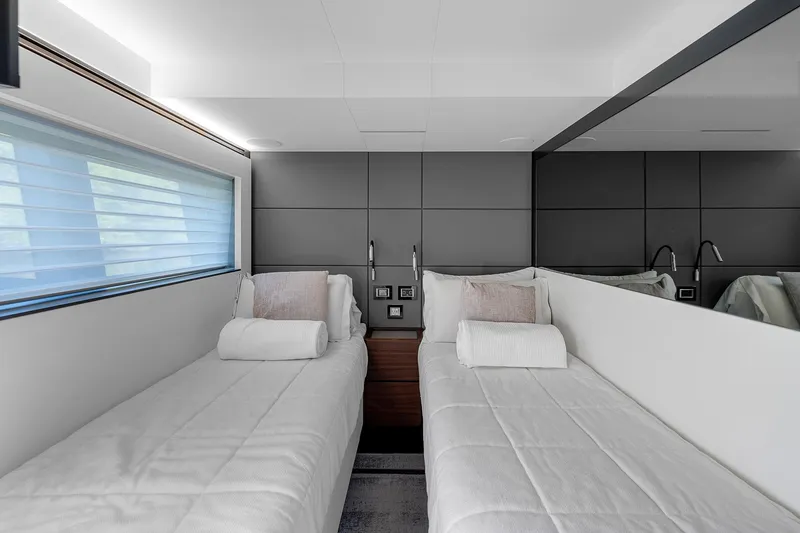 Slide: The Image of Luxurious twin cabin in 2022 Astondoa 66 yacht with modern design and plush bedding. - 21