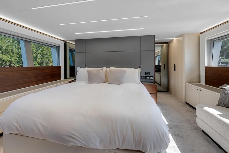 Slide: The Image of Luxurious bedroom interior of 2022 Astondoa 66 yacht with modern design and large windows. - 22
