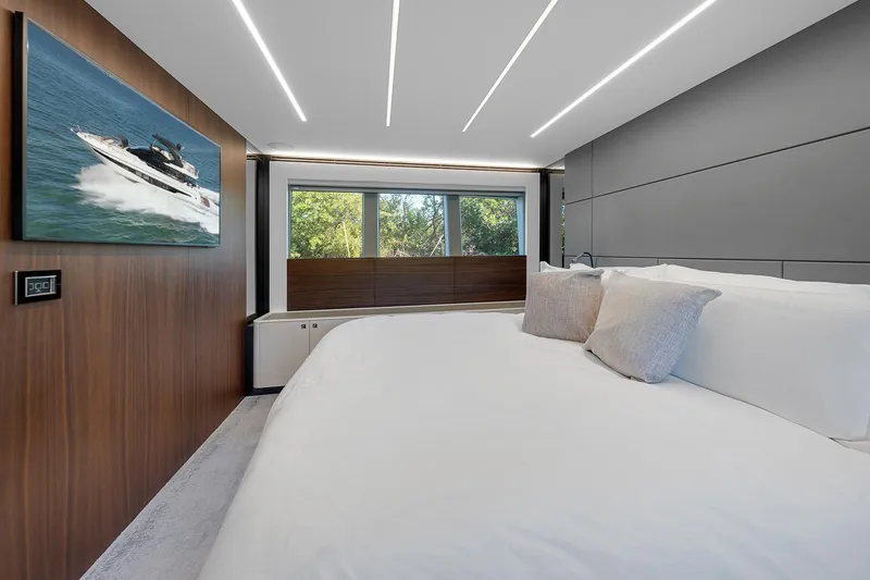 Slide: The Image of Luxurious bedroom interior on 2022 Astondoa 66 yacht with modern design and large windows. - 23