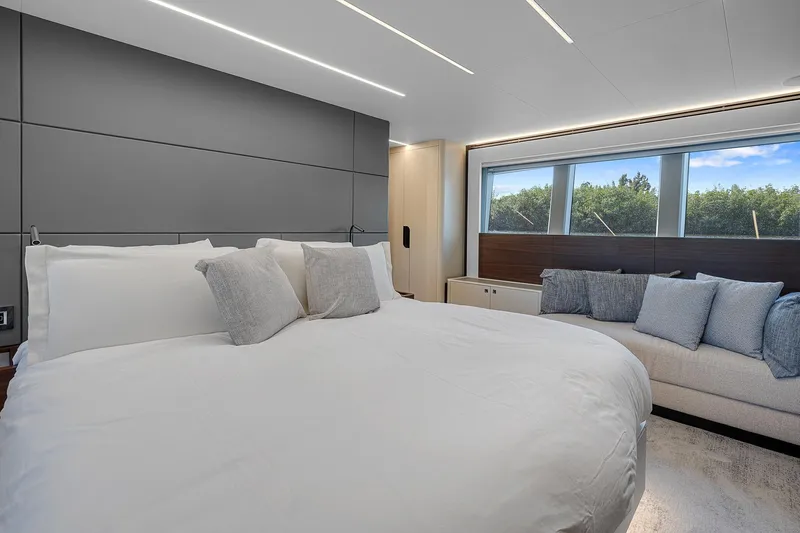 Slide: The Image of Luxurious bedroom in 2022 Astondoa 66 yacht with modern design and large windows. - 24