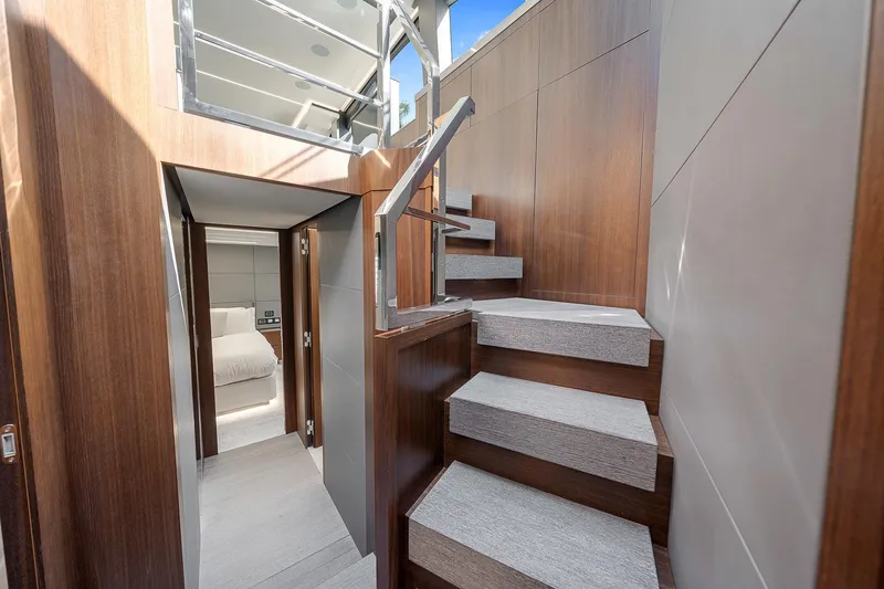Slide: The Image of Interior of 2022 Astondoa 66 yacht with modern staircase and cabin view. - 27