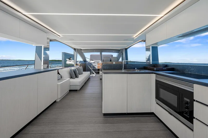 Slide: The Image of Luxurious interior of 2022 Astondoa 66 yacht with modern kitchen and seating area. - 9